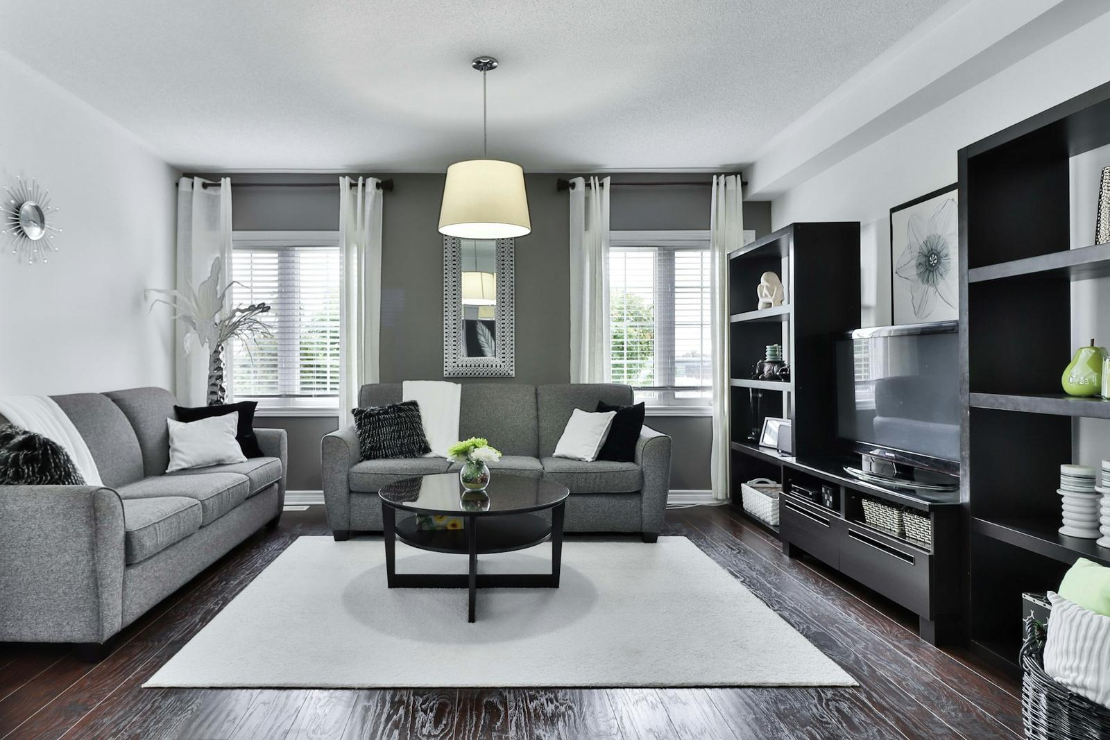 Dated living room with an older dark floor