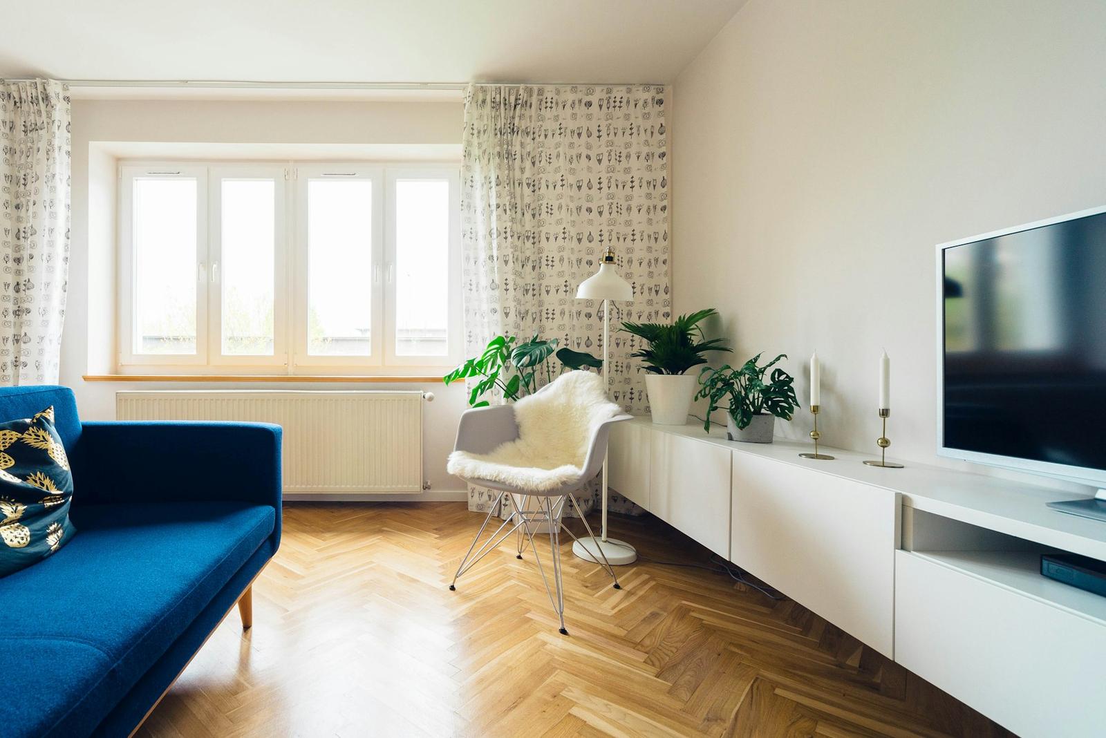 Herringbone wood floor in a bright living room